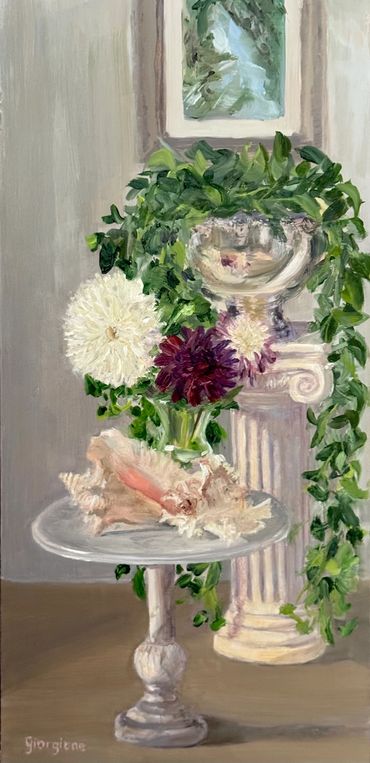 Queen conch seashell, dahlia flowers, round marble table in front of column with silver bowl, plant