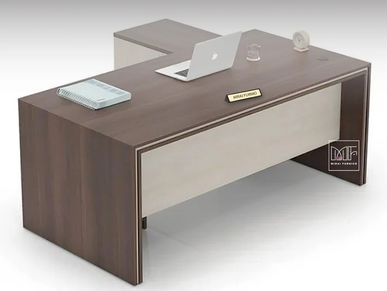 A laptop on a managerial desk in a modern office.
A modern office desk with a lapto.