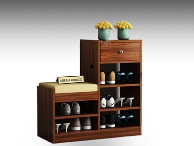 Wooden shoe rack with shoes and a vase on open shoe racks.