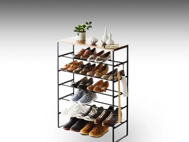 Pair of shoes displayed on modular open shoe rack. A metal shoe rack with wooden top.