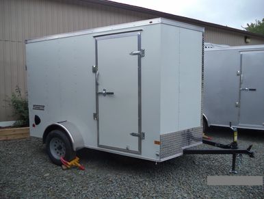 Haulmark 6x12' Passport Deluxe white enclosed utility trailer with rear barn doors.