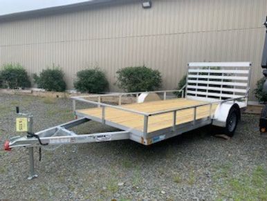 CargoPro 6x12' aluminum open utility trailer with rear ramp, wood deck.