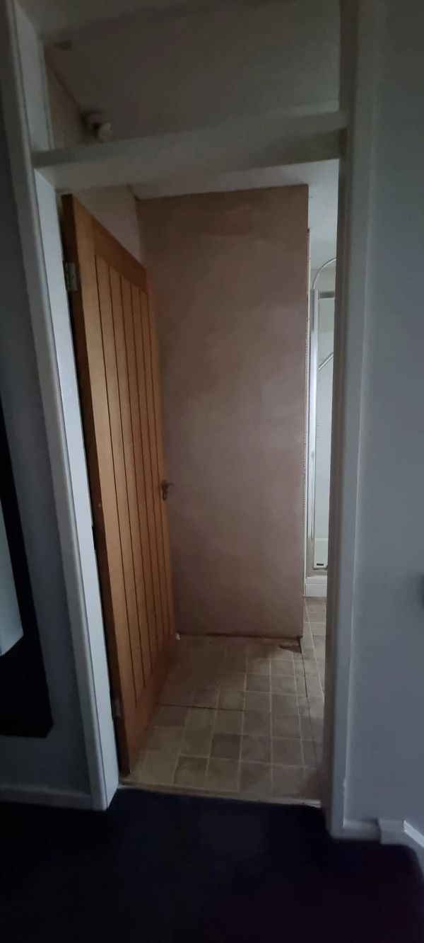 BEFORE: Main bathroom airing cupboard area fully boarded and prepared, ready for tiling.