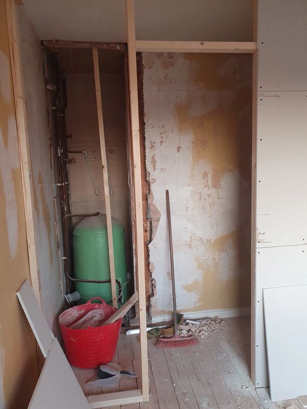 BEFORE: Old airing cupboard and part of the bedroom sectioned off to form the layout for a new ensui