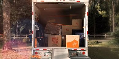 Large moving truck filled with boxes, moving equipment, 