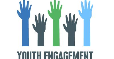 Colorful raised hands symbolizing youth engagement.