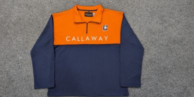 Orange and navy Callaway quarter-zip pullover.