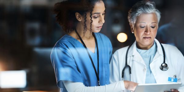Two doctors discussing a patient record