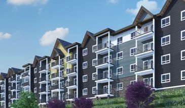 Modern multi-story apartment buildings with balconies and varied exterior colors.