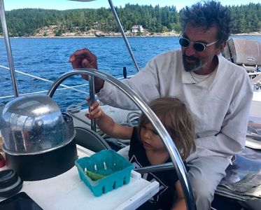 Captain George with grandson Pasha with Salt Spring Island in the background. 