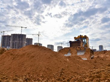 Track-type dozer during of large construction jobs at building site.