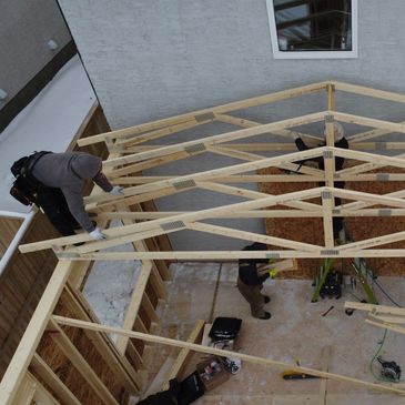 carpenters framing a home addition.