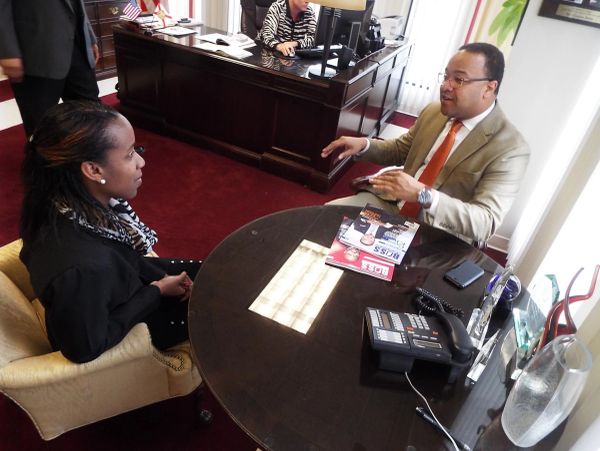Two people having a discussion in an office.