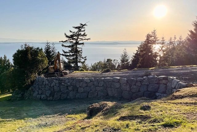 Stone retaining wall, each stone placed thoughtfully. 