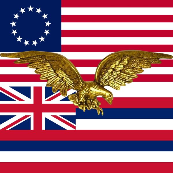 Golden eagle with two historic American flags in the background.