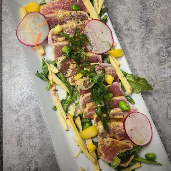 Ahi Tuna Tataki, seared to perfection! Served with in house made corn chips!