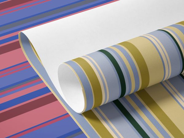 Rolled striped wallpaper with blue, yellow, and green hues.