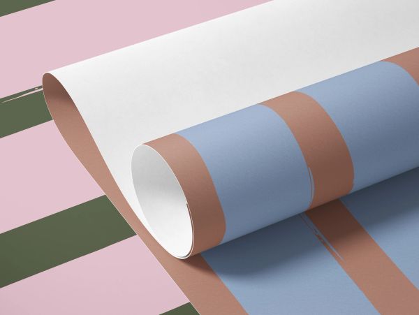 Rolled wallpaper with brown, blue, white, pink, and green stripes.