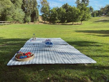 Baby sensory play area on picnic blankets