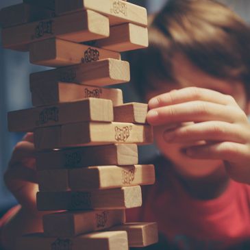 Picture of wood game pieces stacked carefully