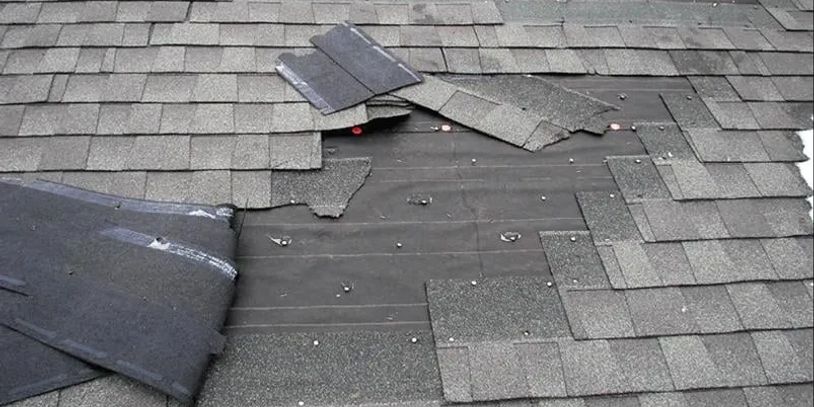 Blown off roof shingles due to strong winds 