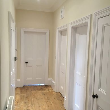 hallway with 4 closed doors