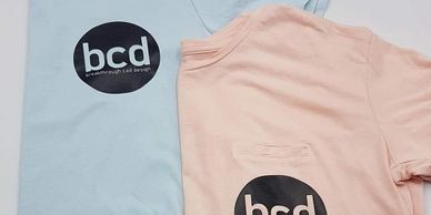Blue and pink shirts with vinyl logo