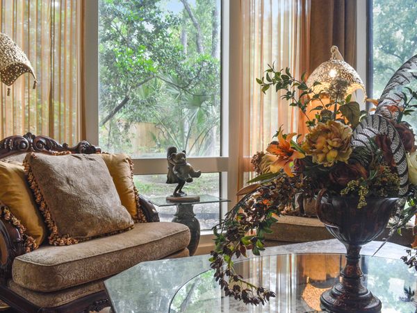 Luxurious living room with large windows.