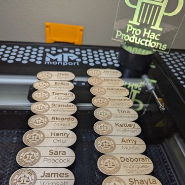 Wooden name tags engraved with names and a North Tampa Bar Association logo.