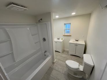 Updated bathroom design with new vanity and fixtures