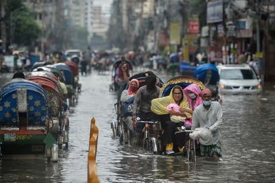 People walking in a flooded street