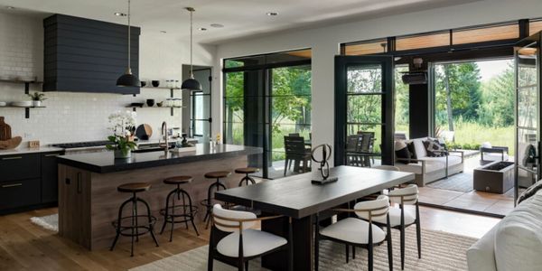 Modern contemporary kitchen, living room and patio space in a recently remodeled home. 