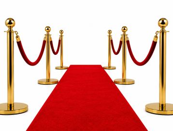 Red carpet with gold stanchions and ropes.