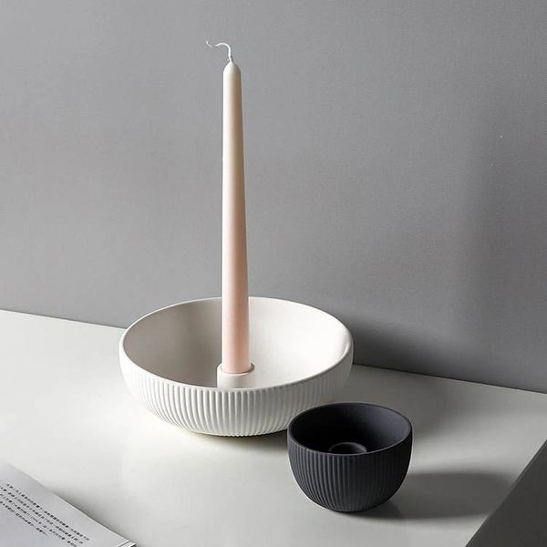 Rounded ceramic stands for tall candles