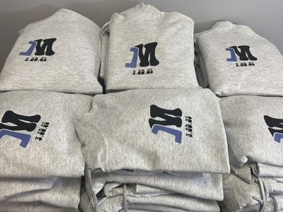 Large stacks of grey hoodies.
