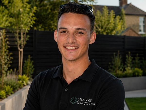 George Salisbury Smiling wearing Salisbury Landscaping Polo top
