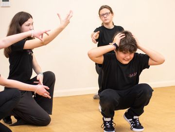 Senior Actors performing inside.