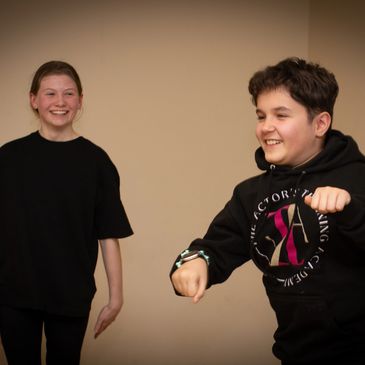 Senior Actors enjoying a drama activity, having fun and smiling.