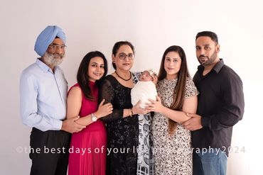 a family of five with a new born baby 