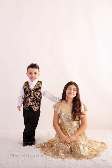 a little girl with her baby brother 