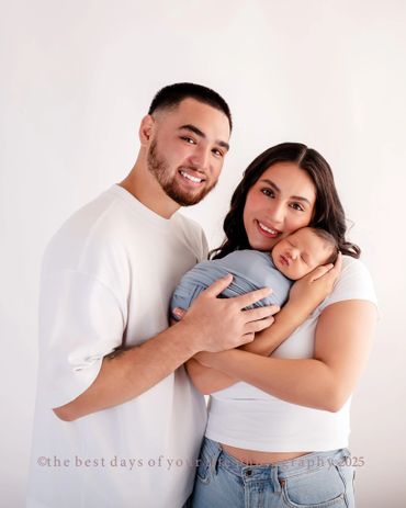 a couple with their newborn baby 