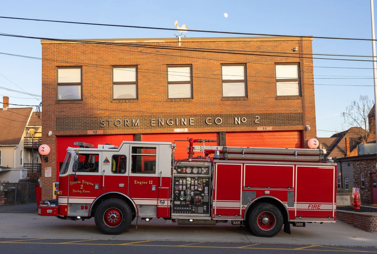 A red fire truck parked in front of Storm Engine Co No 2 fire station.