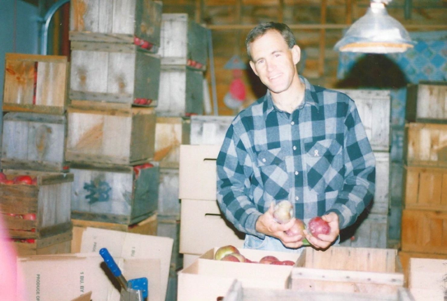 gil barden holding red apples