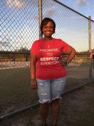 alt="Christian woman wearing a red Promise Principles t-shirt"