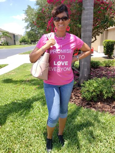 alt="Christian woman wearing a pink Promise Principles t-shirt"