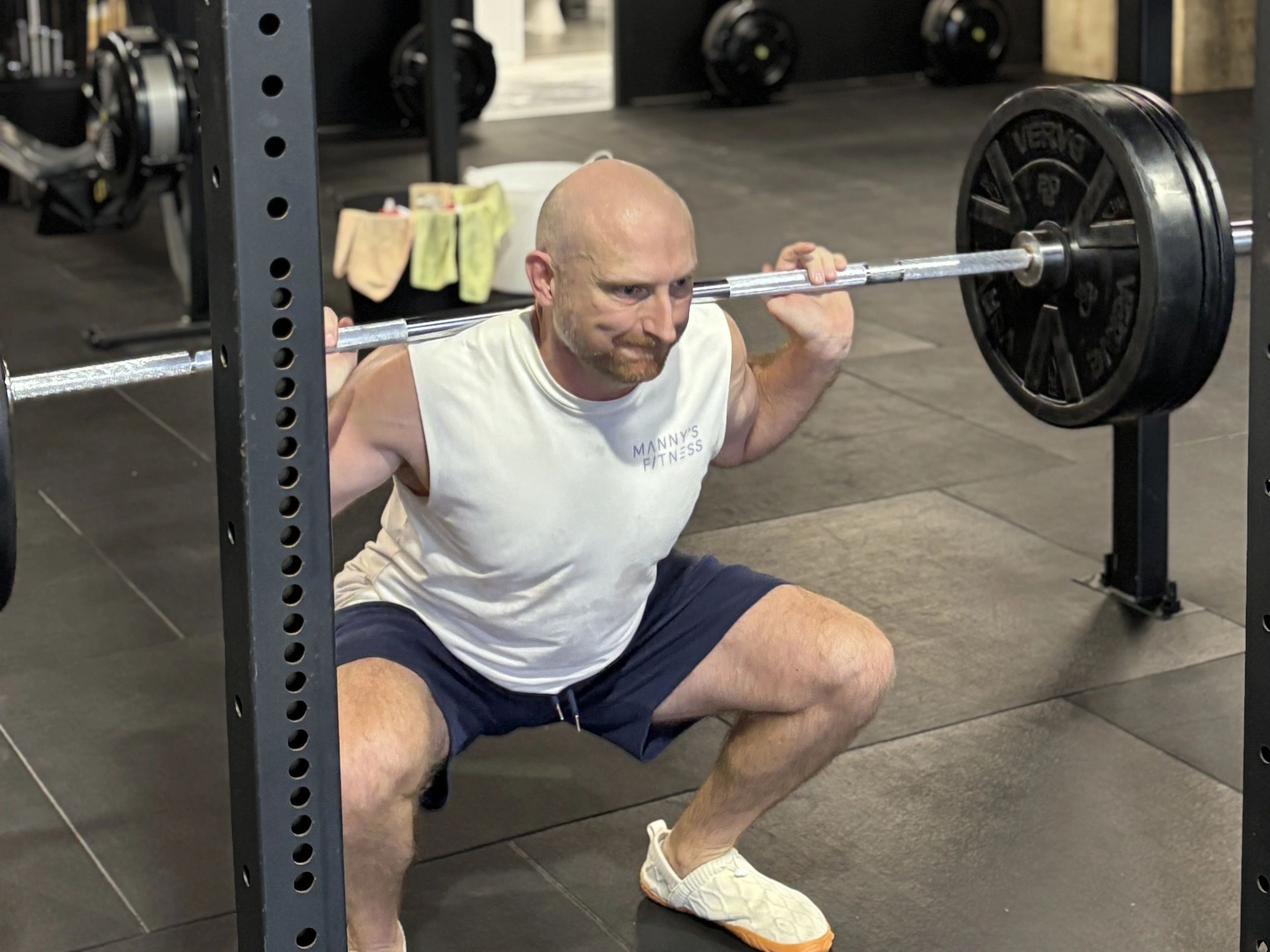 Manny doing a back squat in his own workout.