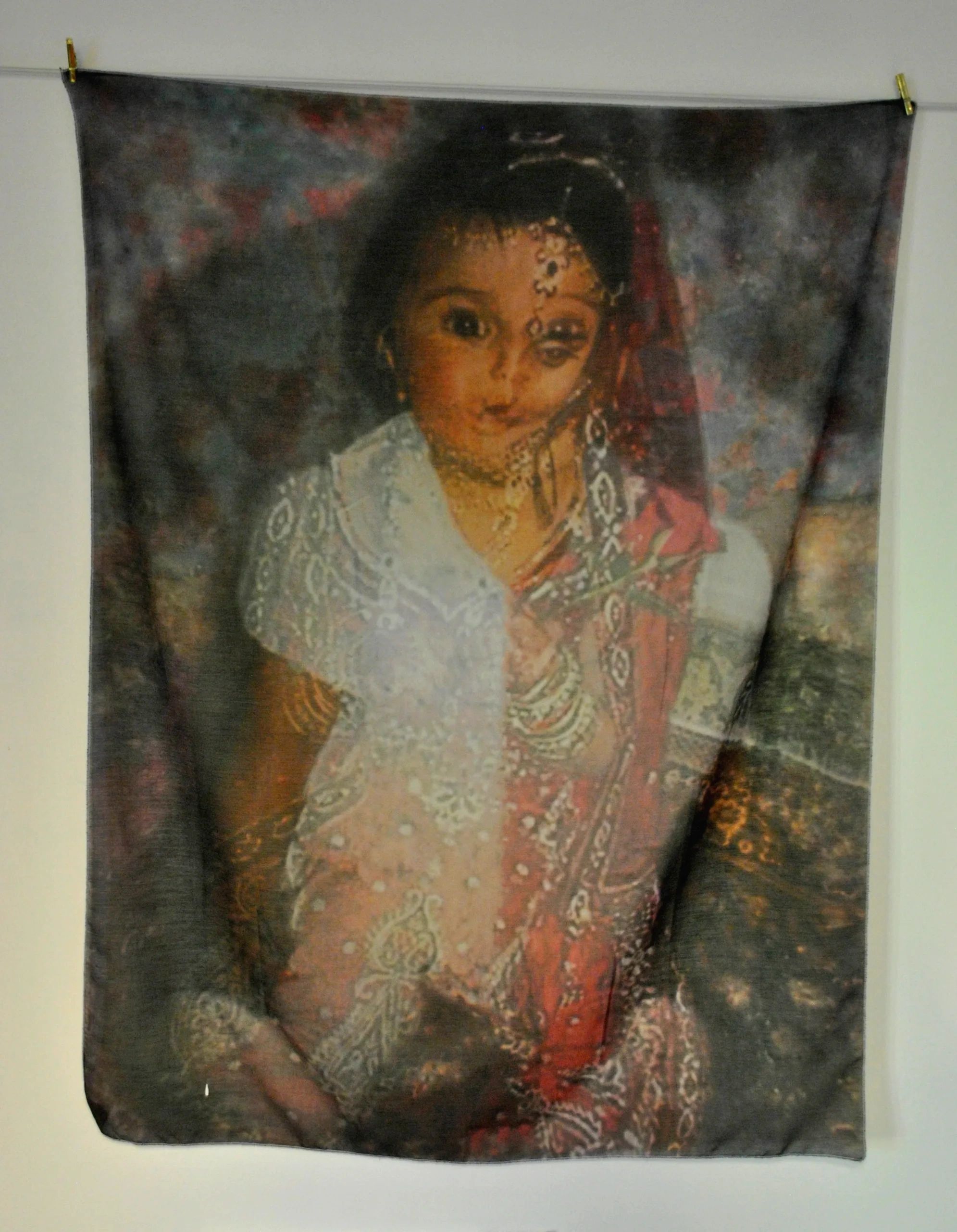 Artistic tapestry of a traditionally dressed woman.