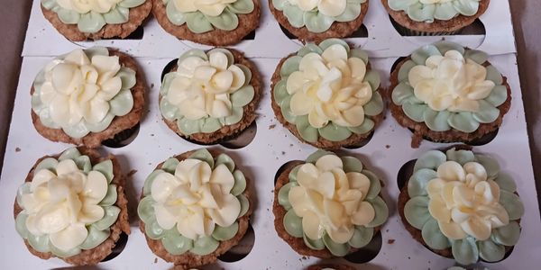 These custom cupcakes were made by All About the Cake. Cupcakes are ideal for parties and functions. 