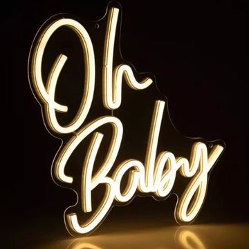 Glowing neon sign saying 'Oh Baby' in cursive script.