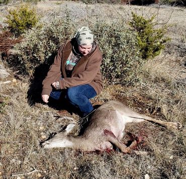 Huntress with her first deer harvest.